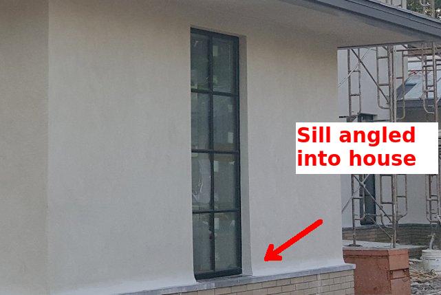 A space is left below the sill to allow horizontal stucco to tuck underneath