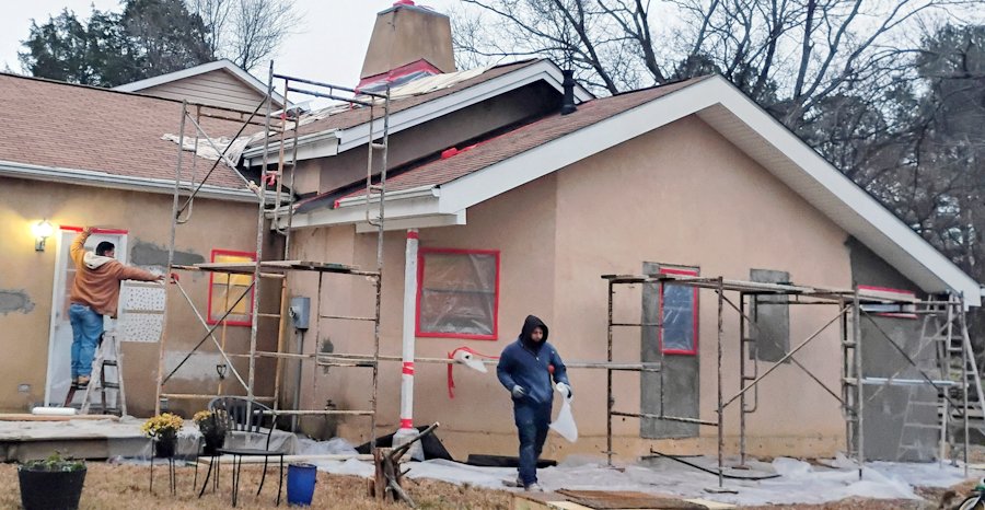 Re-coating unpainted stucco.