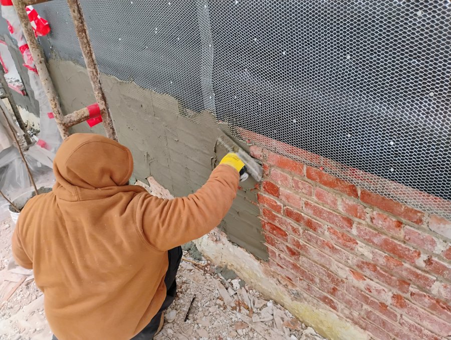 Bonding mortar to old slick bricks.