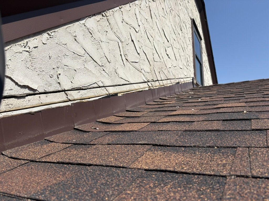 Reglet flashing pulled off the stucco showing the counter flashing.