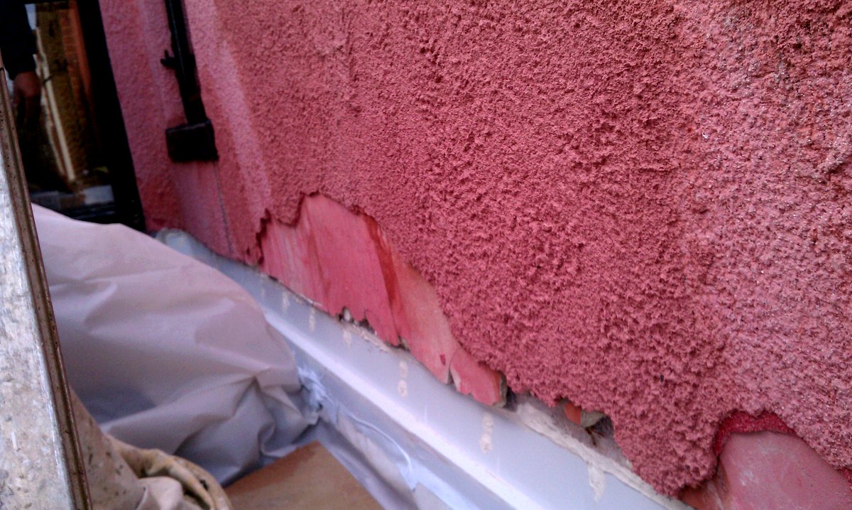 Stucco cut off and a z or s flashing is put over the reglets