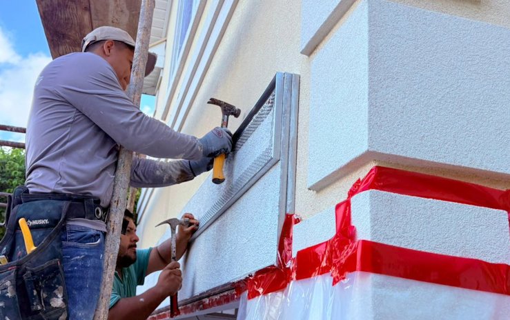 Bands over the garage are formed with 3/4 inch plaster stop (casing bead) and filled.