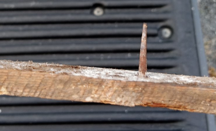 machine made cut nail holding up wood lath