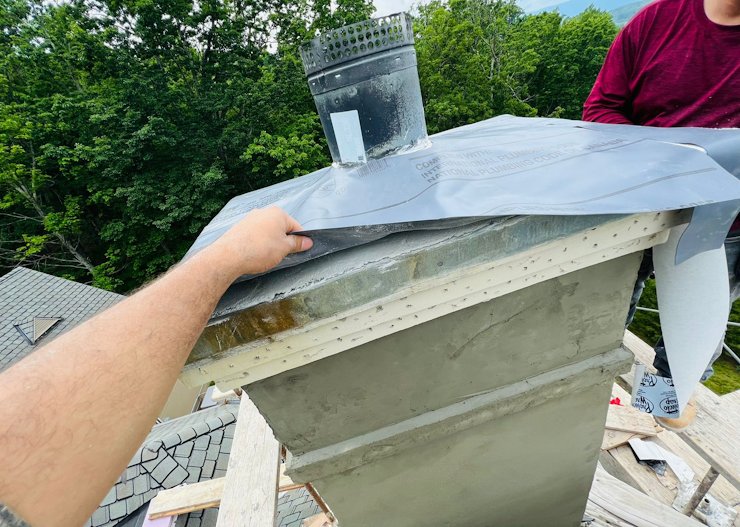 mortar sculptered at an angleRubber membrane on chimney in Charlottesville, Virginia