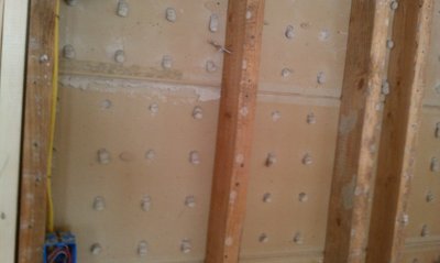 Gypsum lath, known also as Rock lath with holes was referred to as button board