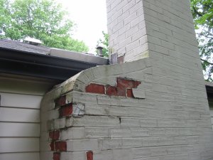 Brick chimney shoulders are porous and are damaged