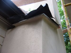 flagstone shoulder and the stuccoed the chimney