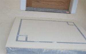 Concrete is coated with stucco finish