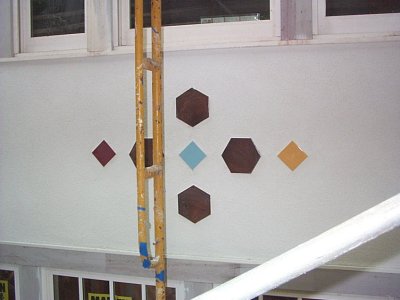 Color tile design livens up a white stucco wall