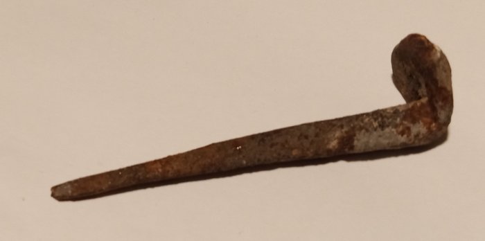 large hand made nail was from a house built between 1810 and 1822