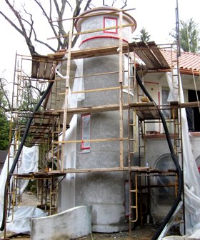 brown coat on the stair tower is as straight and round.