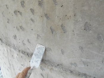 Stucco bonded to concrete