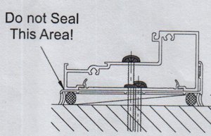 weep grooves are frequently sealed with caulk